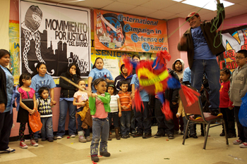 February 2010: The Third Encuentro for Dignity and Against Displacement, organized by Movement for Justice in El Barrio, ends with a crowd of excited children helping to smash the "neoliberal piata." Photo by Michael Gould-Wartofsky.